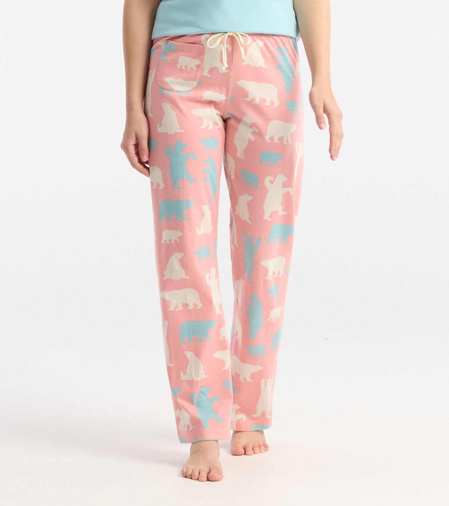 Pink cotton pyjama pants featuring a playful polar bear pattern in white and blue, with an elastic waistband and drawstring.