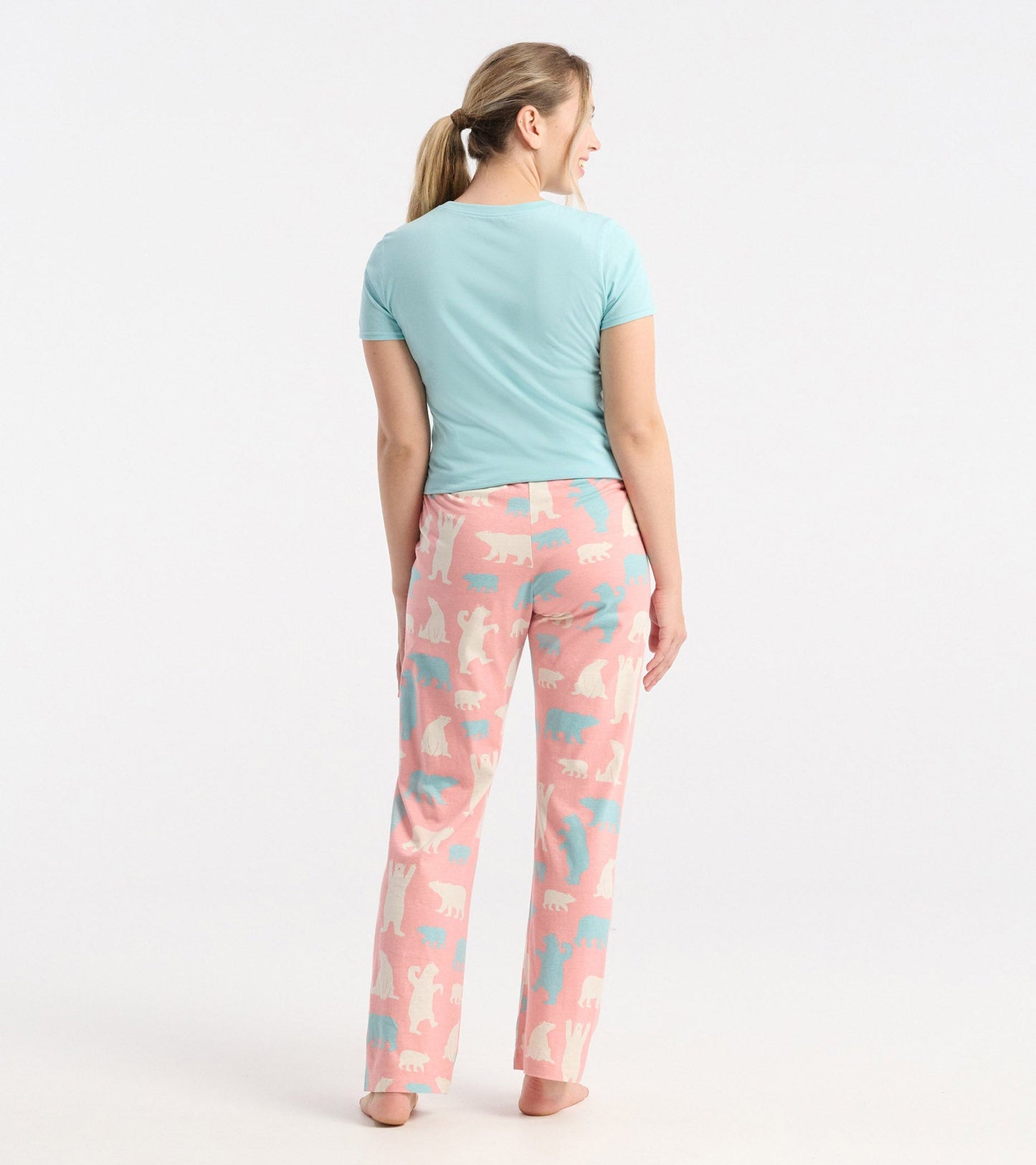 Women's cotton pyjama pants in pink with polar bear patterns, featuring a relaxed fit and soft fabric.