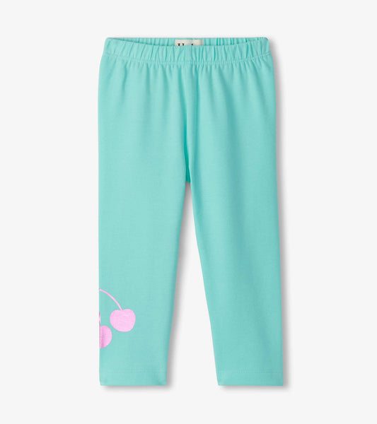 Light blue leggings featuring a pink cherry graphic on the lower side, designed for baby and toddler girls.