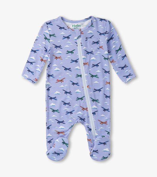 Light purple footed sleeper featuring colorful airplane patterns and a front zipper, designed for baby boys.