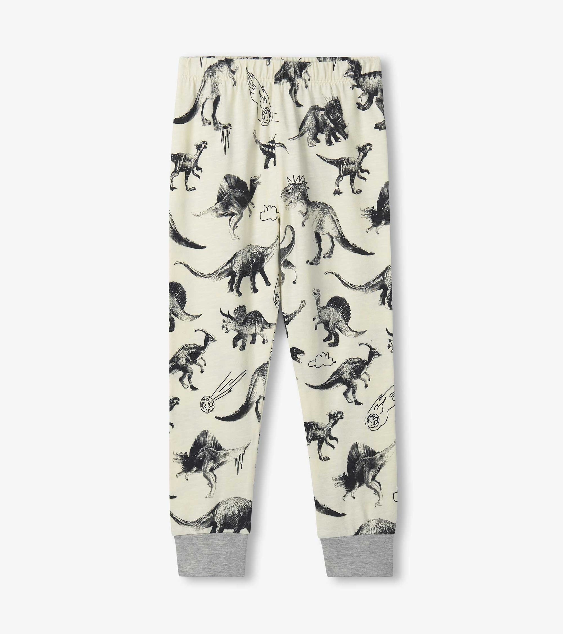 Light-colored pyjama pants featuring a playful dinosaur print, with elastic waistband and grey cuffs at the ankles.