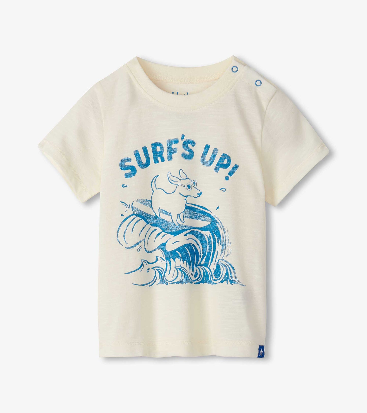 Cream short-sleeve tee featuring a blue surf graphic with a dog on a surfboard, ideal for baby and toddler boys.