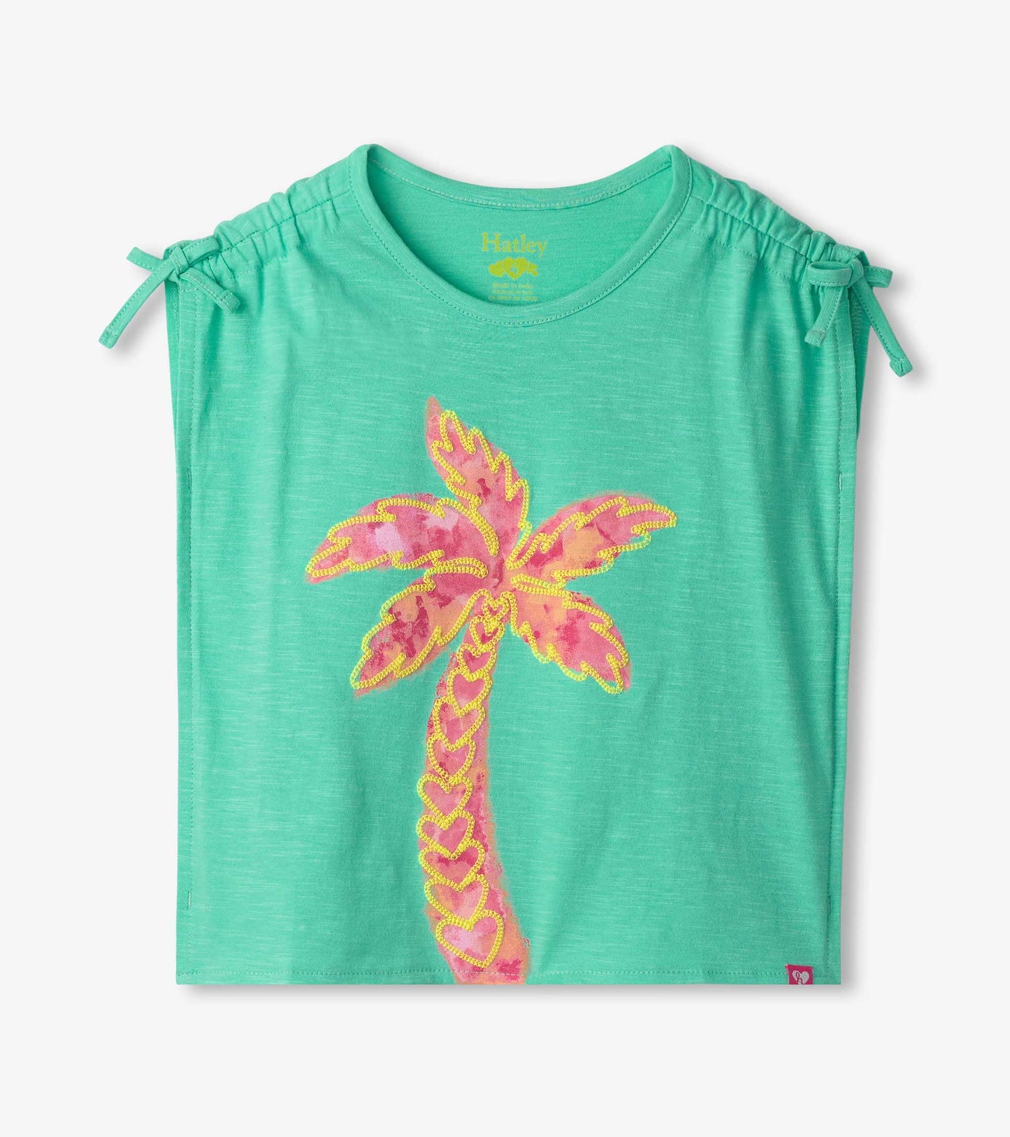 Mint green cinched shoulder top featuring a colorful palm tree design.