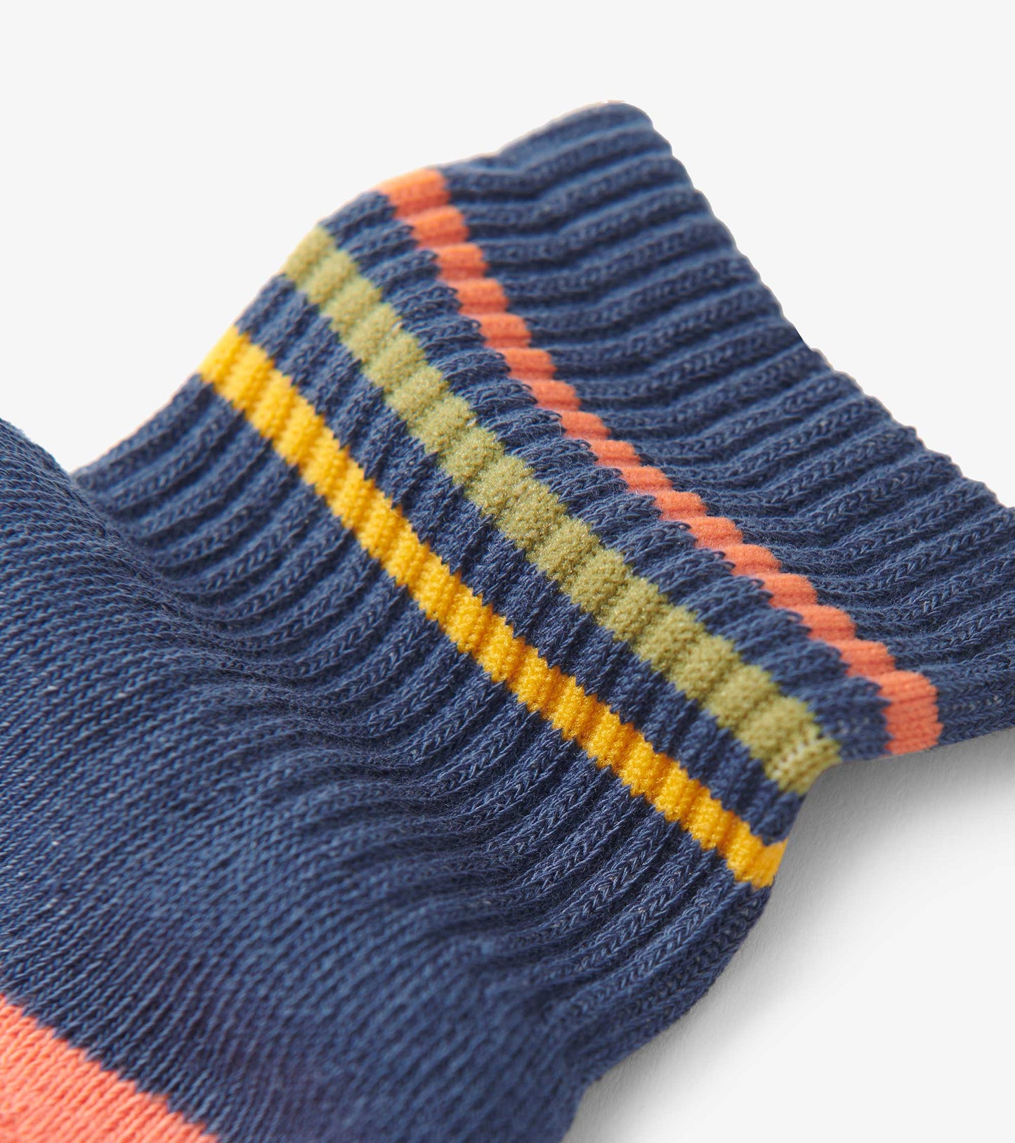 Blue crew socks featuring colorful striped patterns in orange, yellow, and green, made from soft, ribbed material.