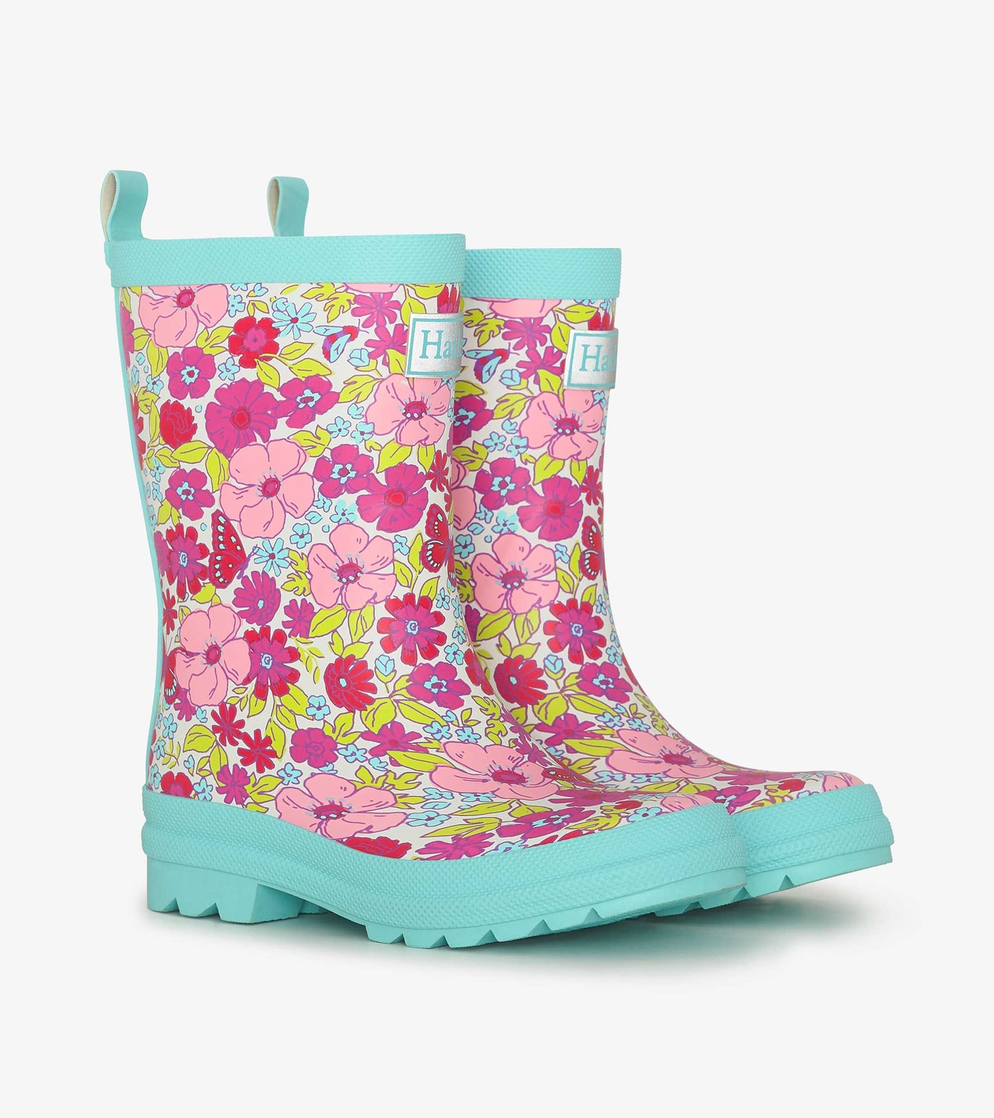 Colorful matte wellies featuring a vibrant floral pattern in pink, yellow, and blue with a textured sole for grip.