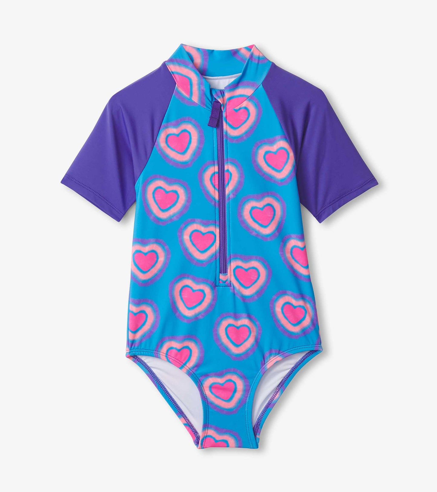 One-piece rashguard featuring a blue background with pink and purple heart patterns and short purple sleeves.