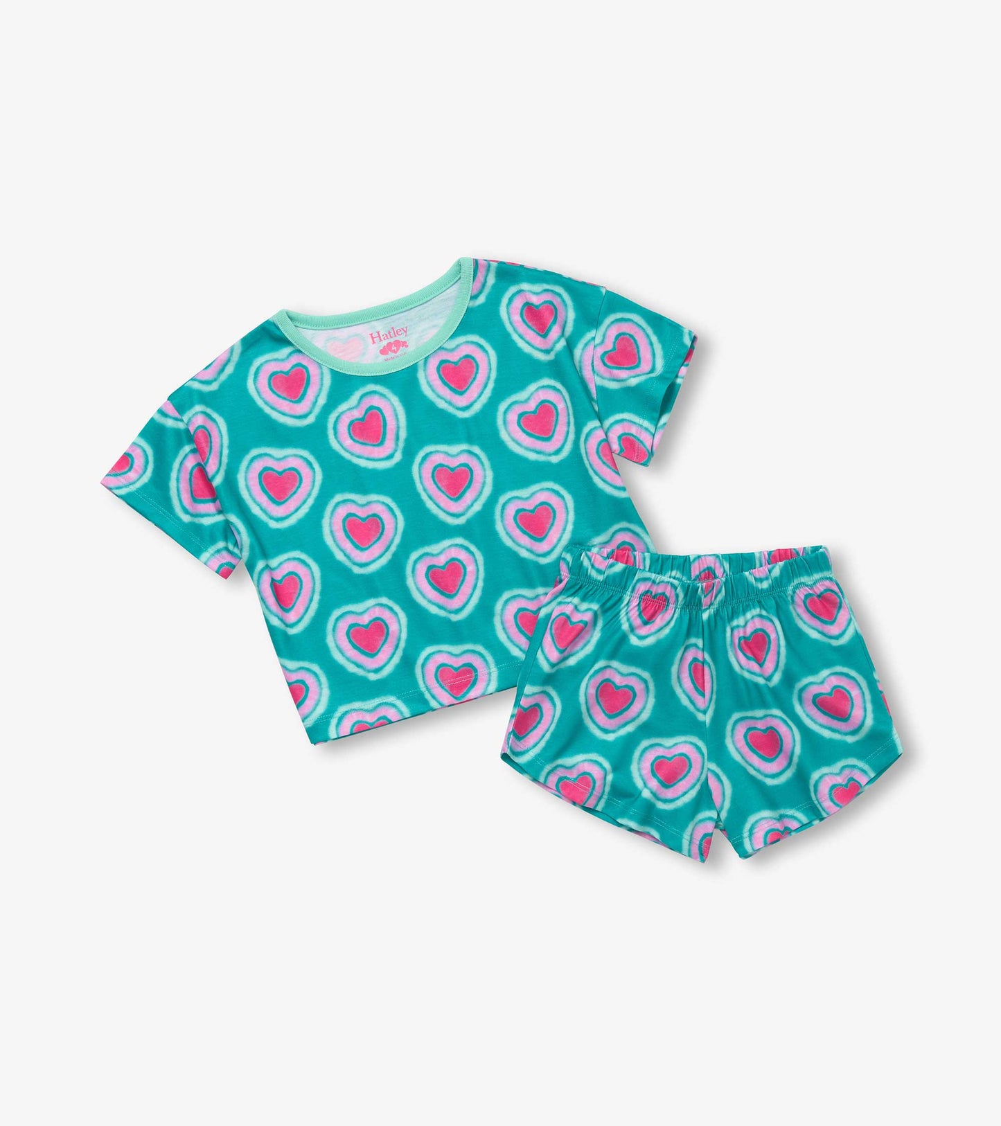 Teal pajama set featuring a short-sleeve tee and shorts, both adorned with pink glowing hearts pattern.