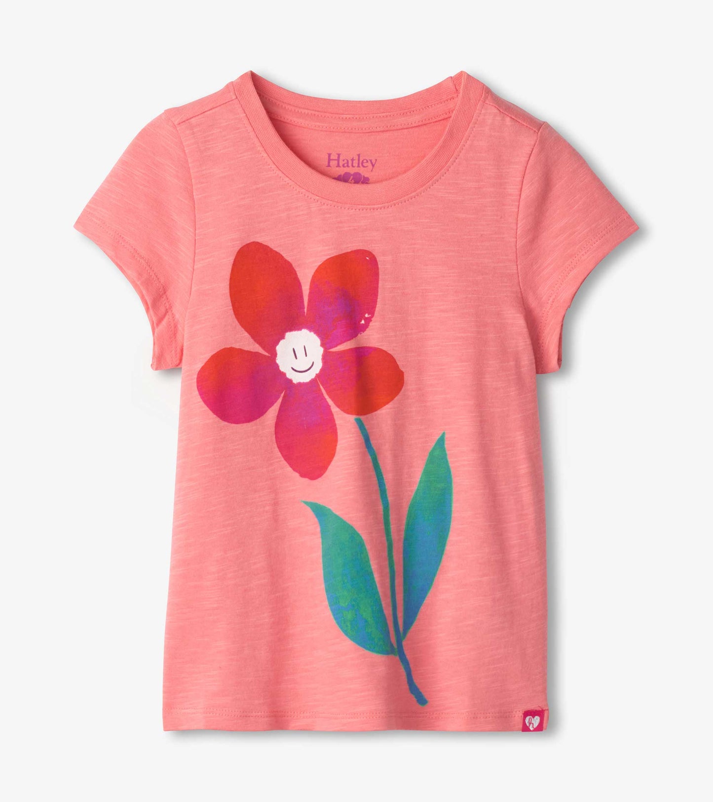Pink short-sleeve tee featuring a colorful daisy graphic with a smiling face and green leaves.