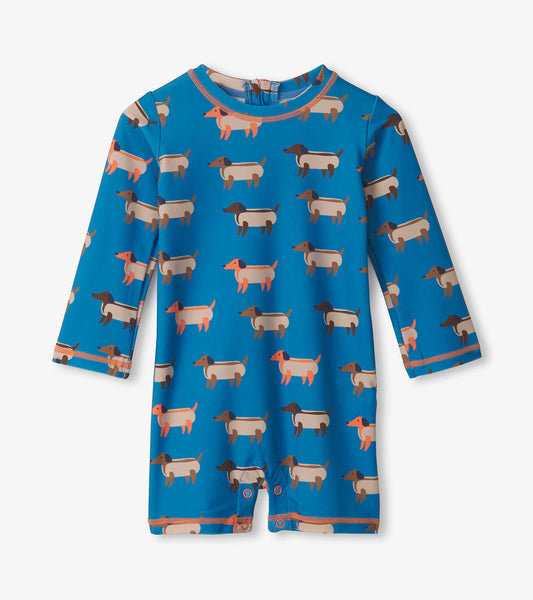 Blue long-sleeve rashguard featuring a playful hot dog pattern, designed for baby boys with snap closures at the bottom.