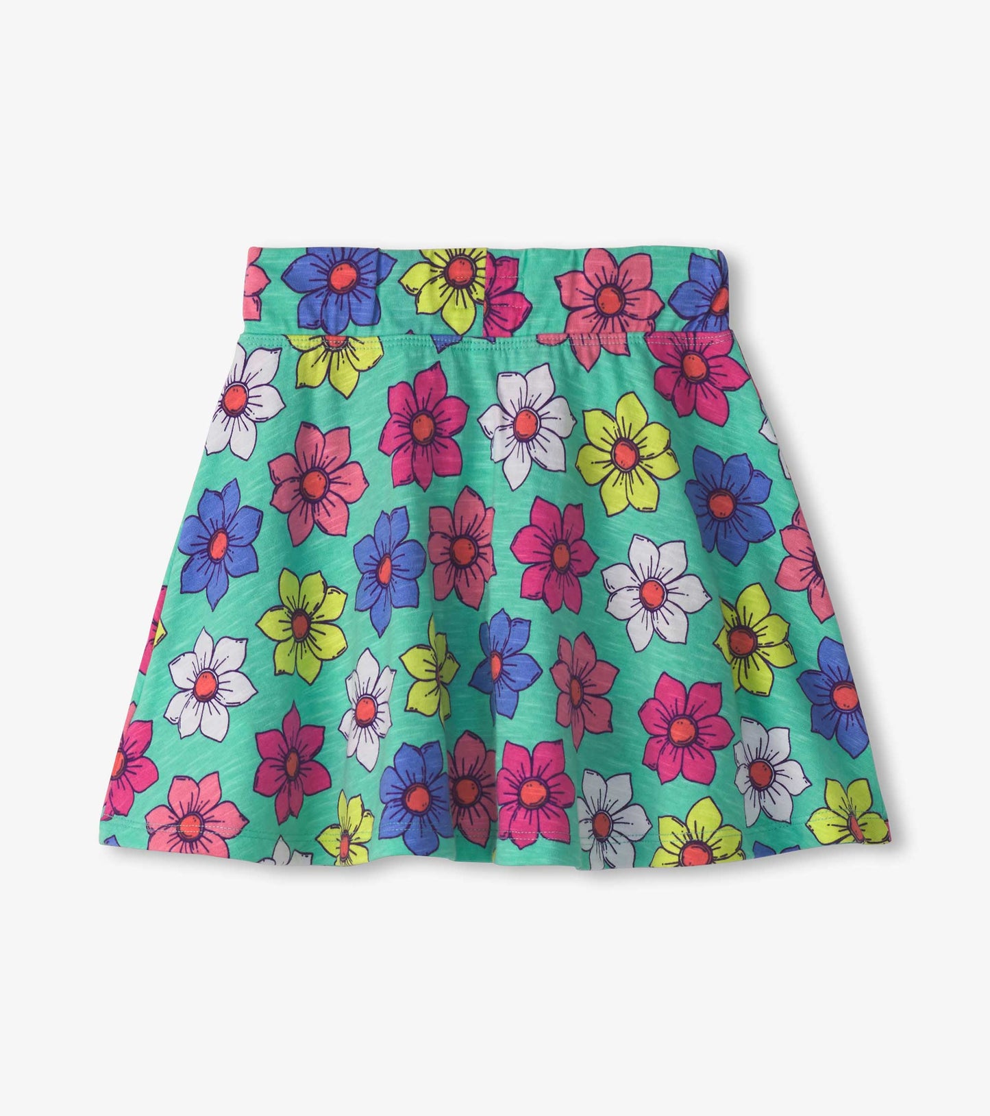 Colorful skort featuring a floral pattern with pink, blue, yellow, and white flowers on a green background.