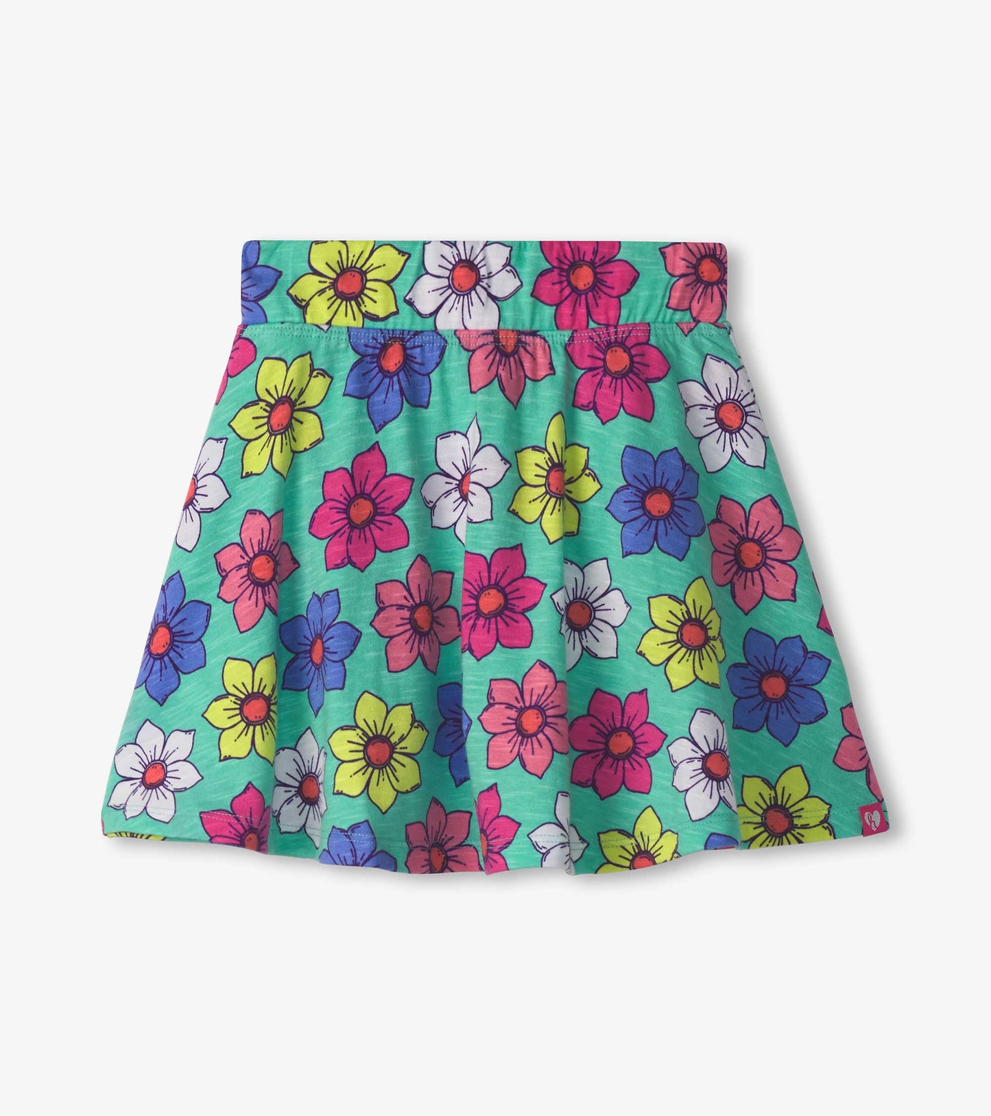 Colorful skort featuring a floral pattern with pink, yellow, and blue flowers on a green background.