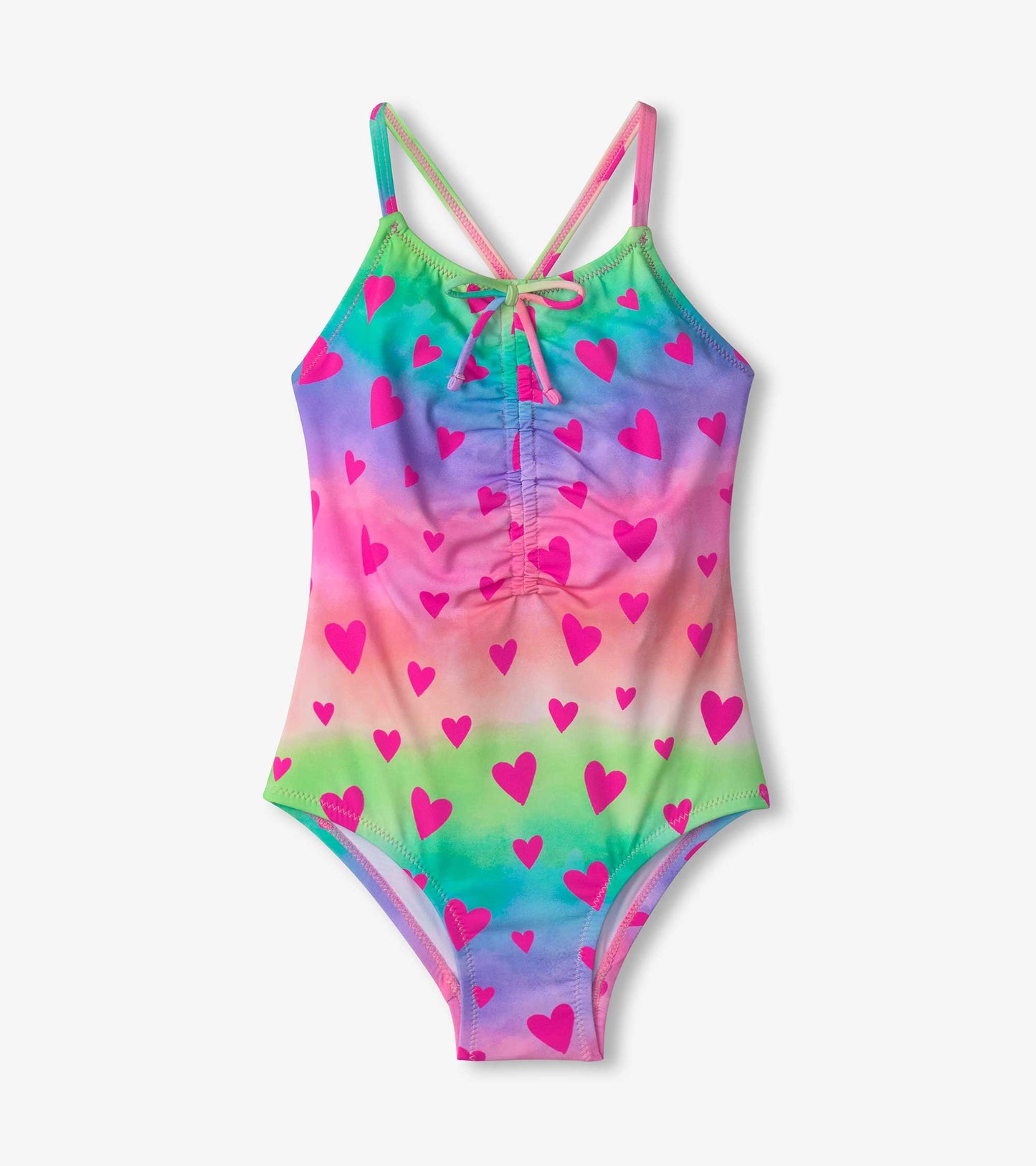 Colorful swimsuit featuring a ruched front design with a gradient pattern and pink heart prints. Adjustable straps included.