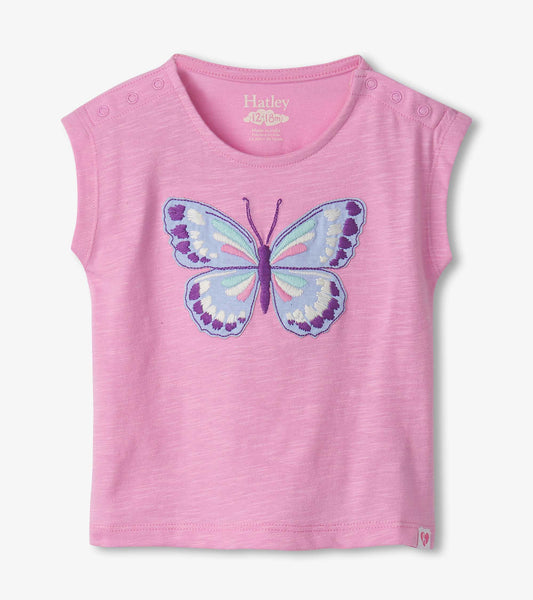 Pink short-sleeve shirt featuring an embroidered butterfly design on the front and snap buttons on the shoulder.