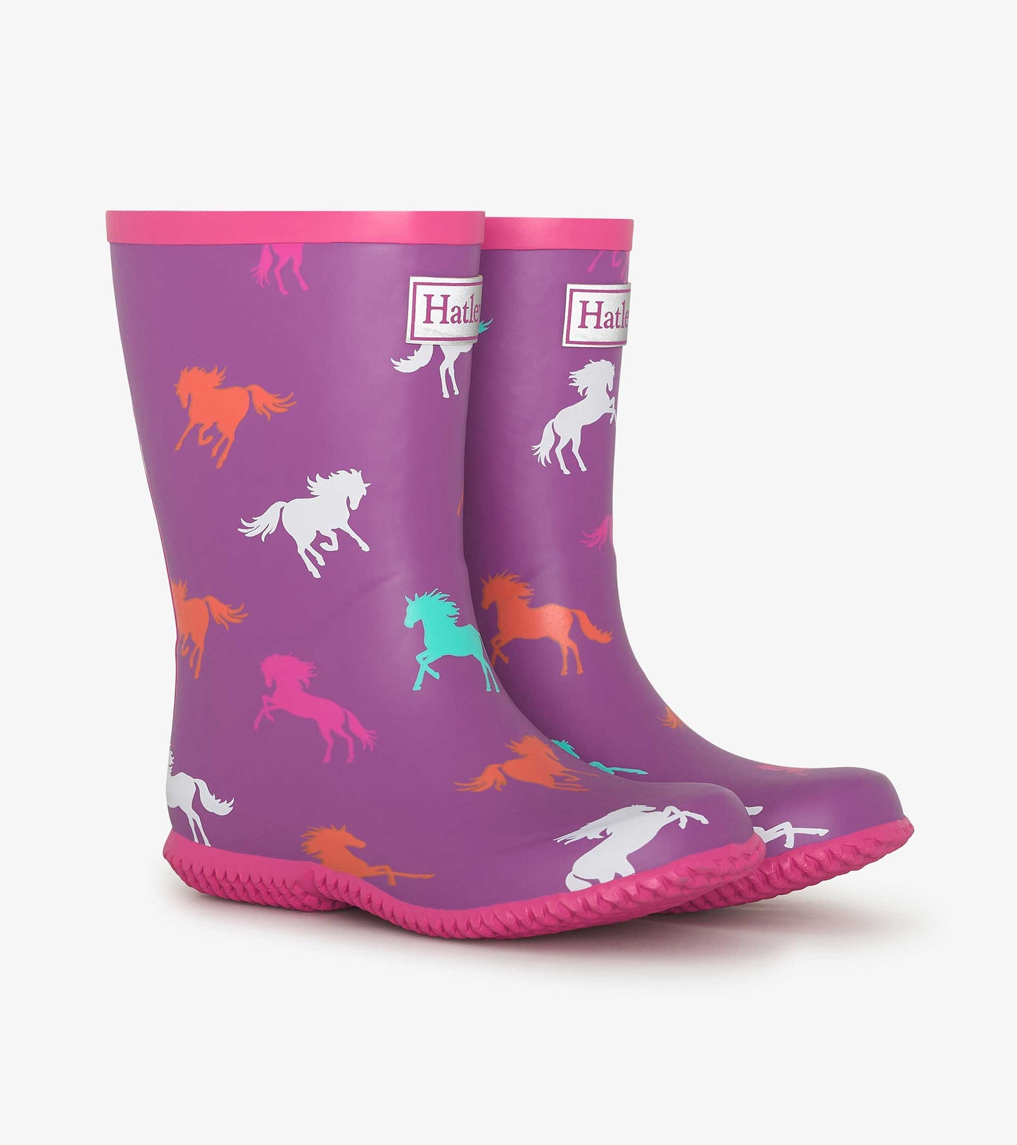 Purple waterproof wellies featuring colorful leaping horse patterns and a pink trim, suitable for kids.