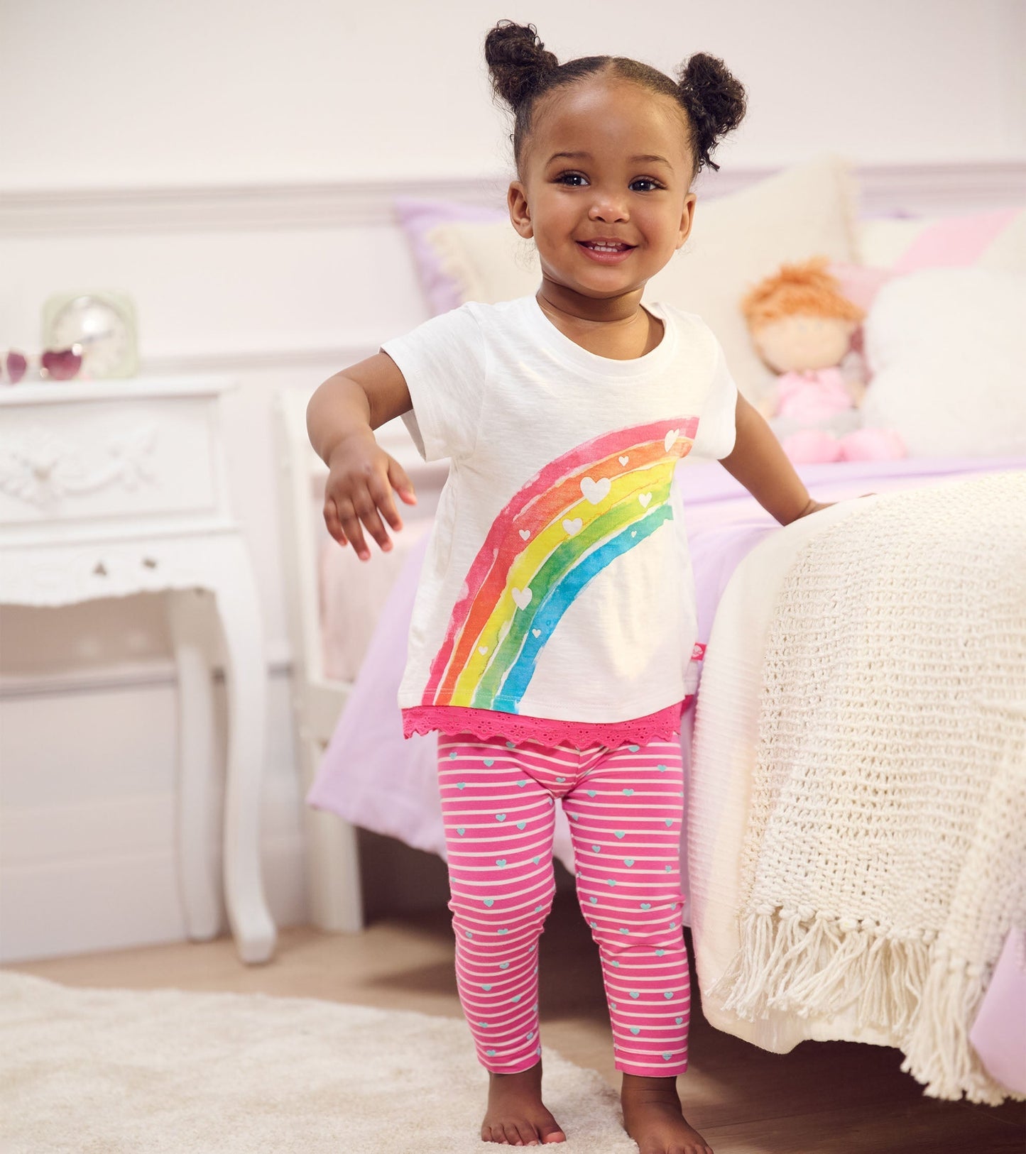 Pink striped leggings with heart patterns, made from soft bamboo material, suitable for baby and toddler girls.