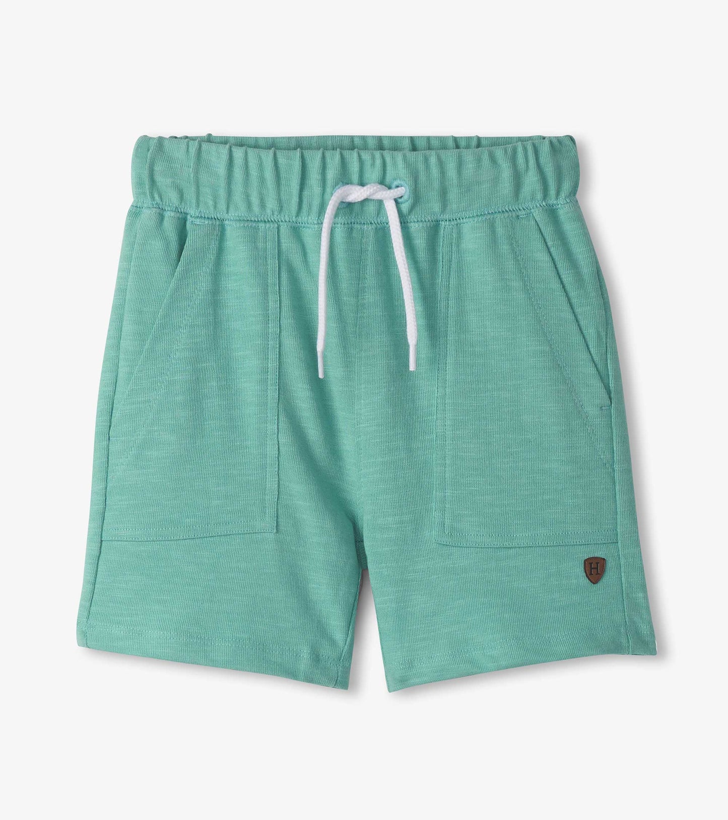 Light blue relaxed shorts with an elastic waistband and drawstring, featuring side pockets and a small logo patch.