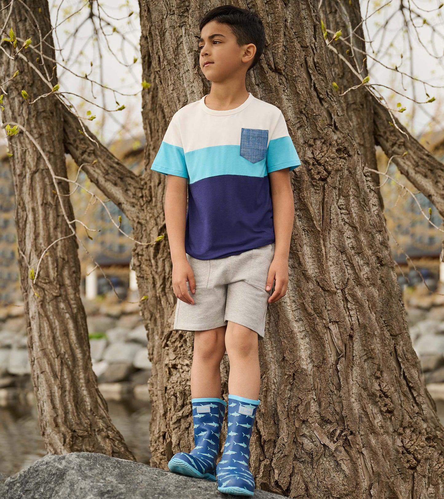 Boys' short-sleeve t-shirt in blue and white color block design with a chest pocket, made from soft bamboo fabric.