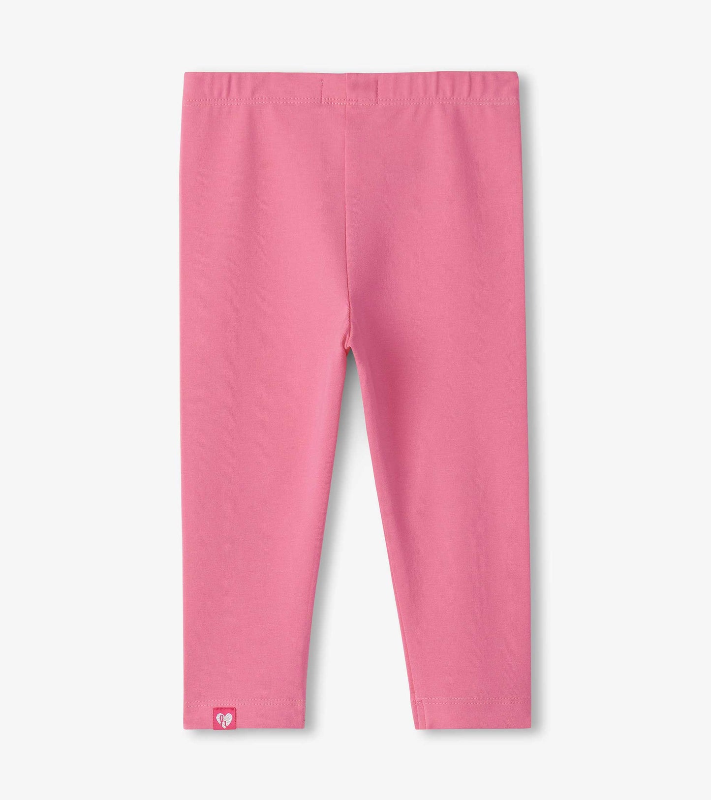 Pink classic leggings for baby and toddler girls, featuring a soft, stretchy material and an elastic waistband.