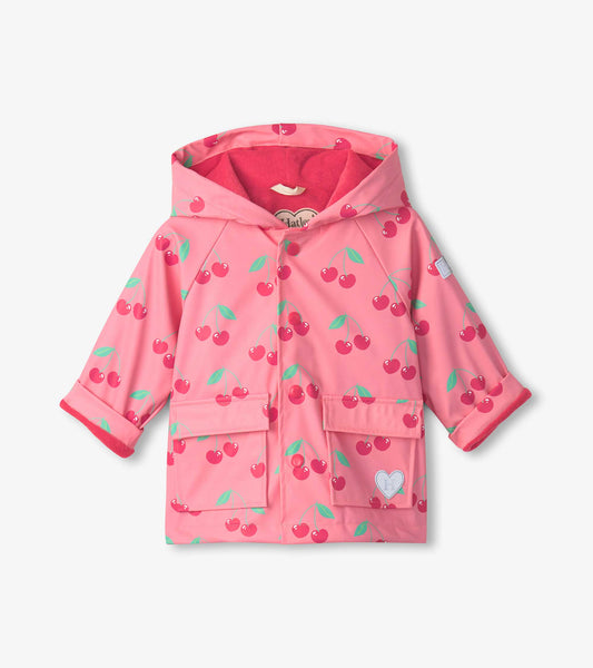 Pink button-up raincoat for toddlers featuring a cherry pattern and two front pockets. Hooded design with a soft lining.