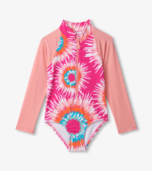 Long sleeve rashguard swimsuit featuring a pink and multicolor sunburst tie-dye pattern, with a front zipper.