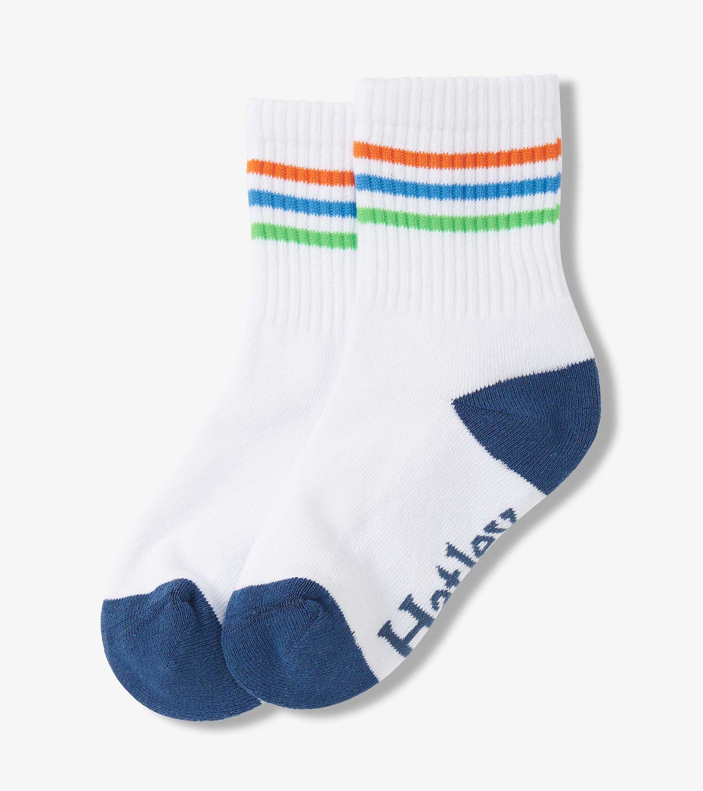 White crew socks with colorful stripes in orange, blue, and green, featuring a navy blue heel and toe.