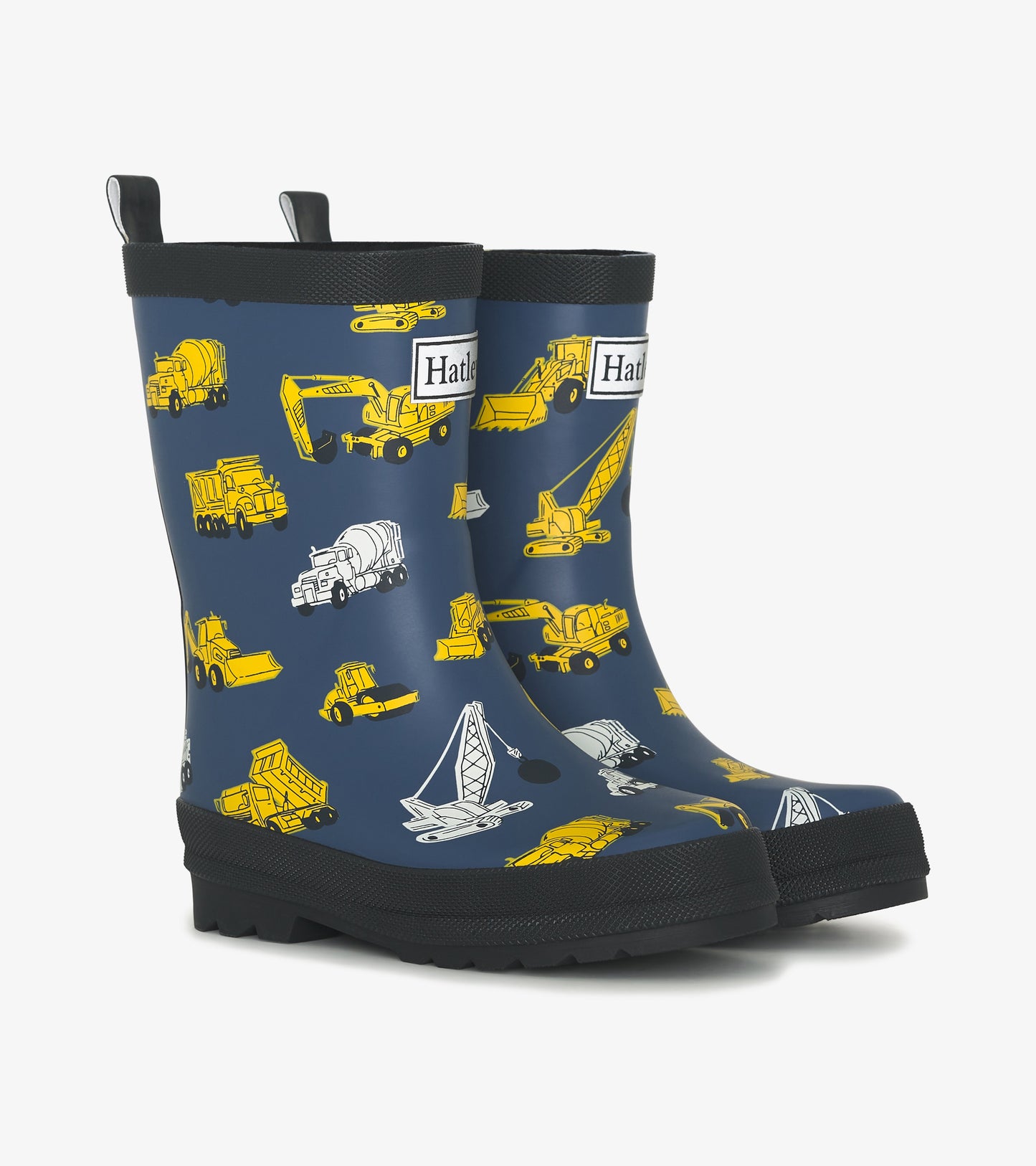 Matte navy wellies featuring yellow construction vehicle patterns, designed for boys, with a textured black sole.