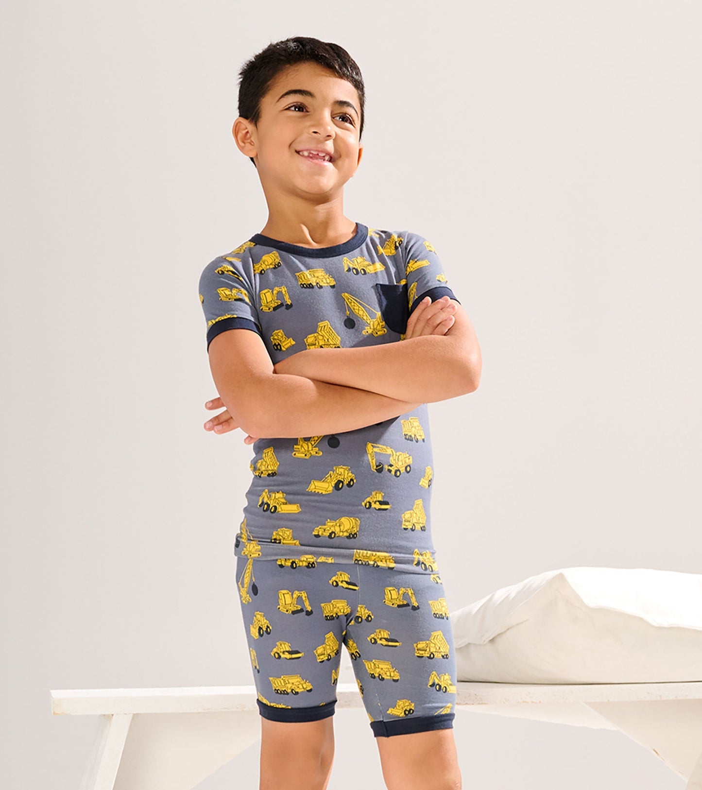 Gray bamboo short pyjama set featuring yellow construction vehicle prints, suitable for boys aged 2 to 12.