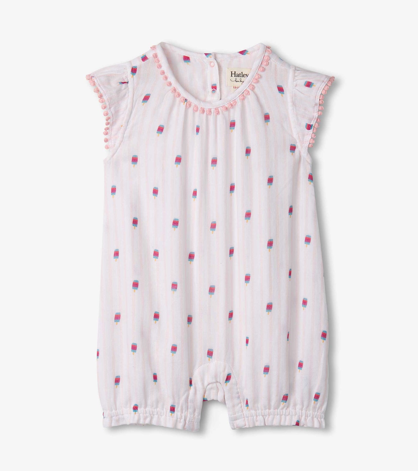 White shortall with colorful popsicle print, ruffled sleeves, and pom-pom trim around the neckline. Suitable for toddlers.