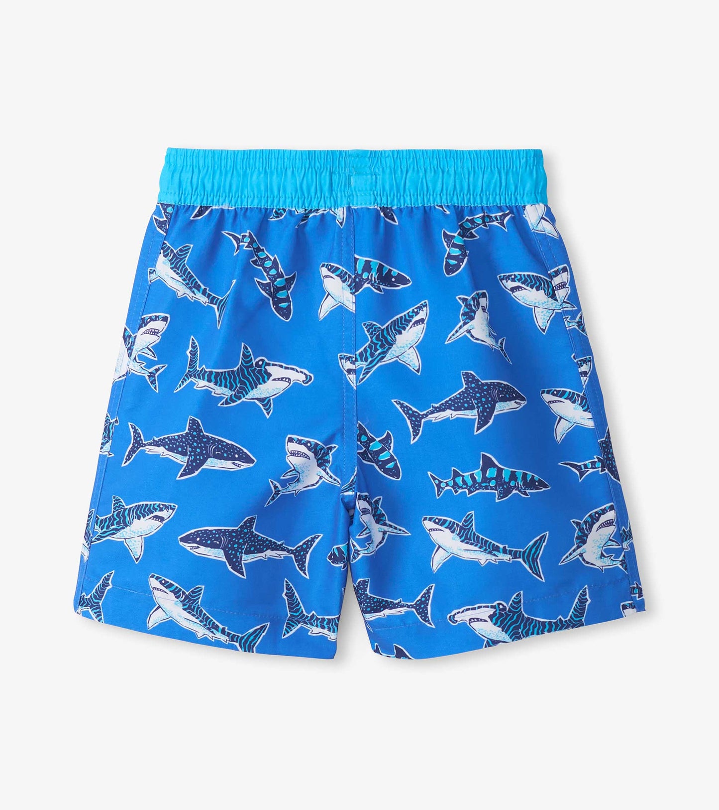 Blue boys swim trunks with shark print and elastic waistband, front view