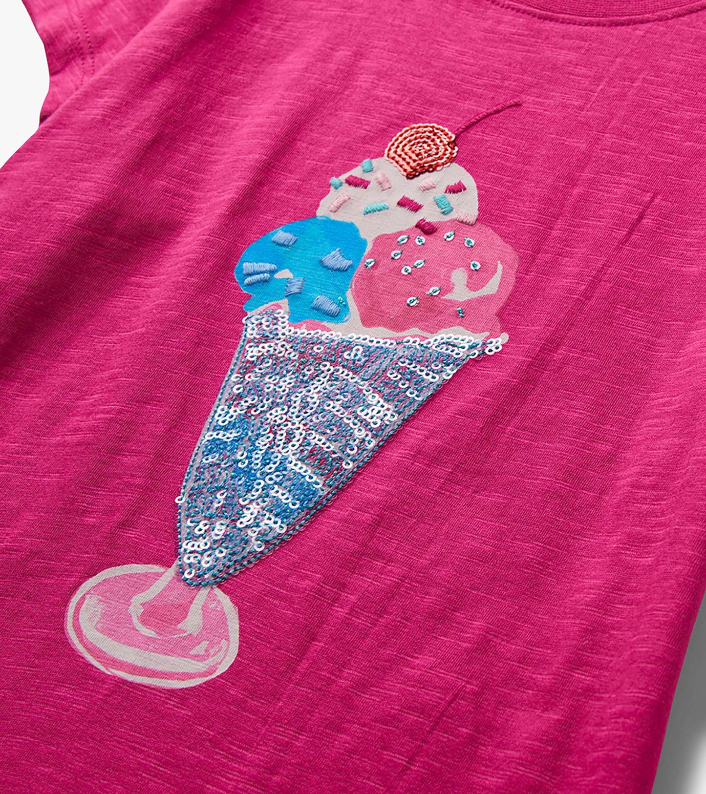 Pink girls graphic tee with sequined ice cream cone design on the front