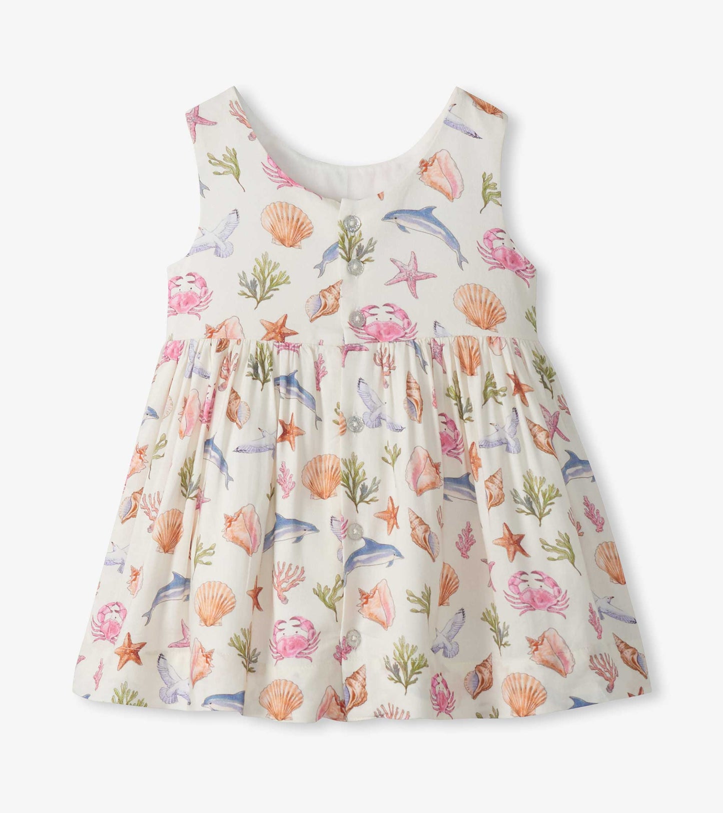 Sleeveless cream toddler dress with colorful sea life print and button-front bodice, front view