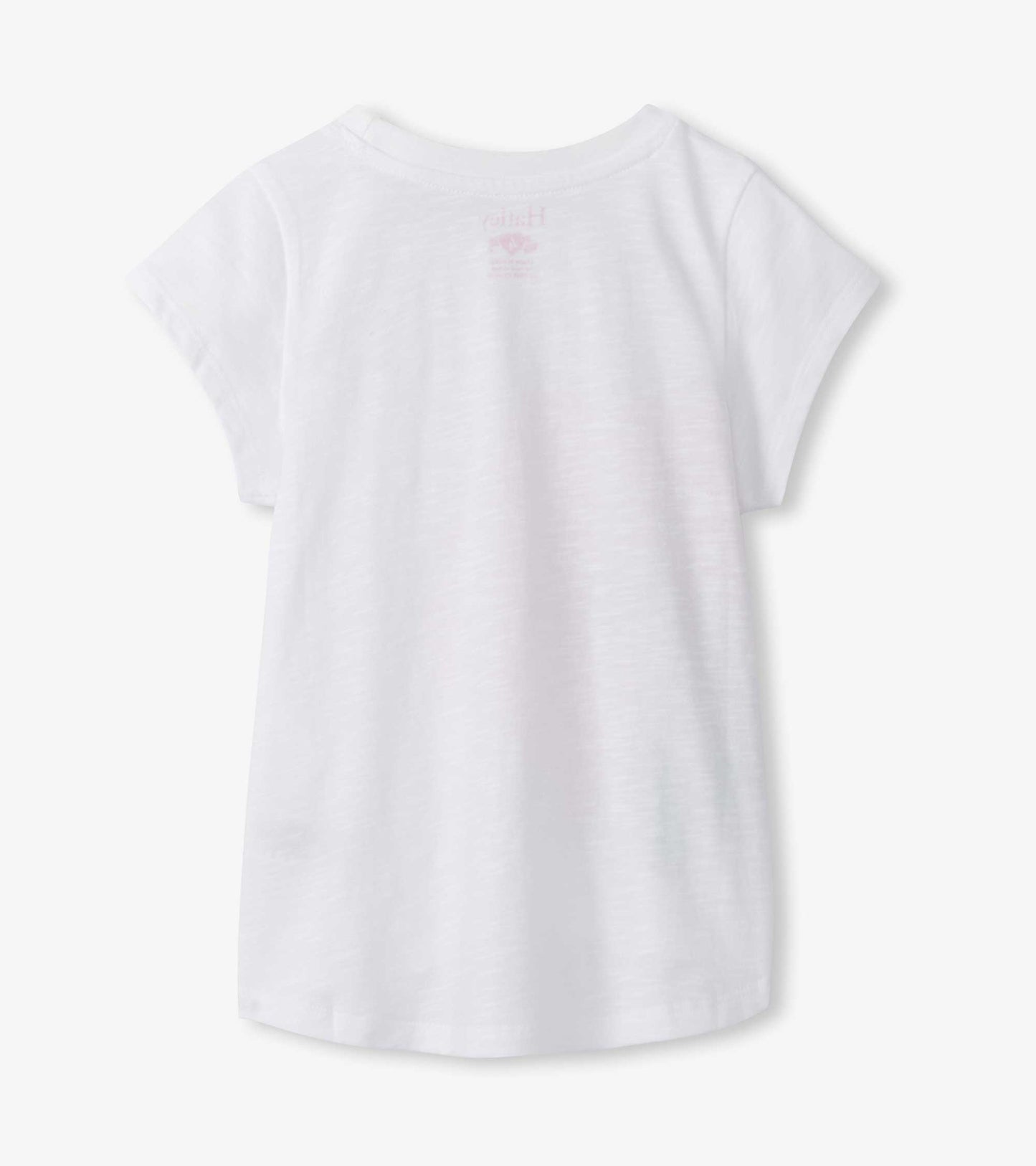 White short-sleeve girls T-shirt with crew neck and subtle pink hibiscus graphic on back, front view