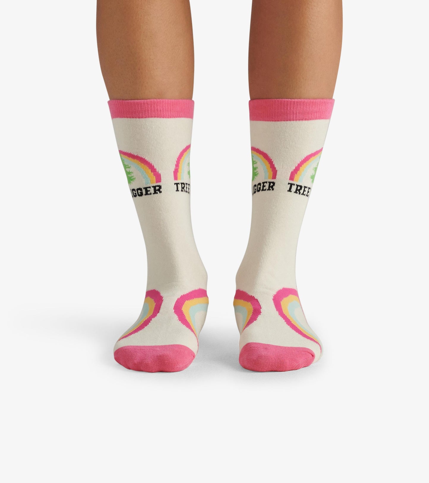 Cream crew socks with pink cuffs, featuring tree and rainbow patterns, designed for casual wear.