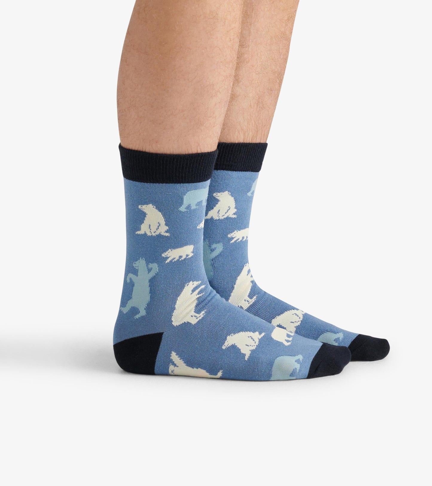 Men's crew socks in blue featuring a polar bear pattern, with a black cuff and toe. One size fits most.