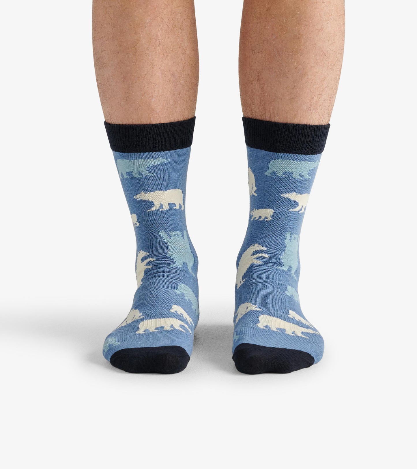 Men's crew socks in blue featuring a polar bear pattern, with a black cuff and soft fabric for comfort.