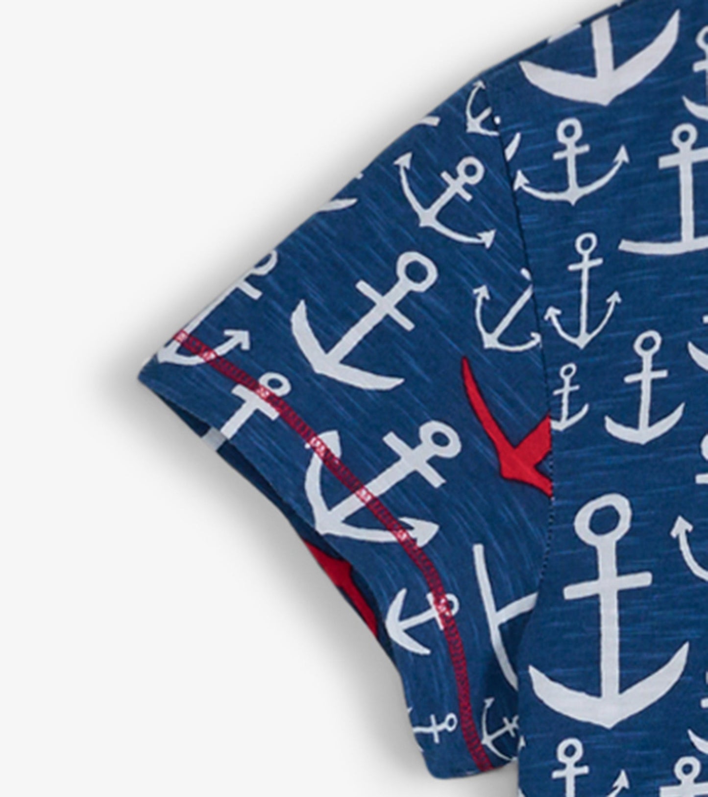 Navy crew neck t-shirt dress featuring a white anchor pattern with red accents, suitable for casual wear.
