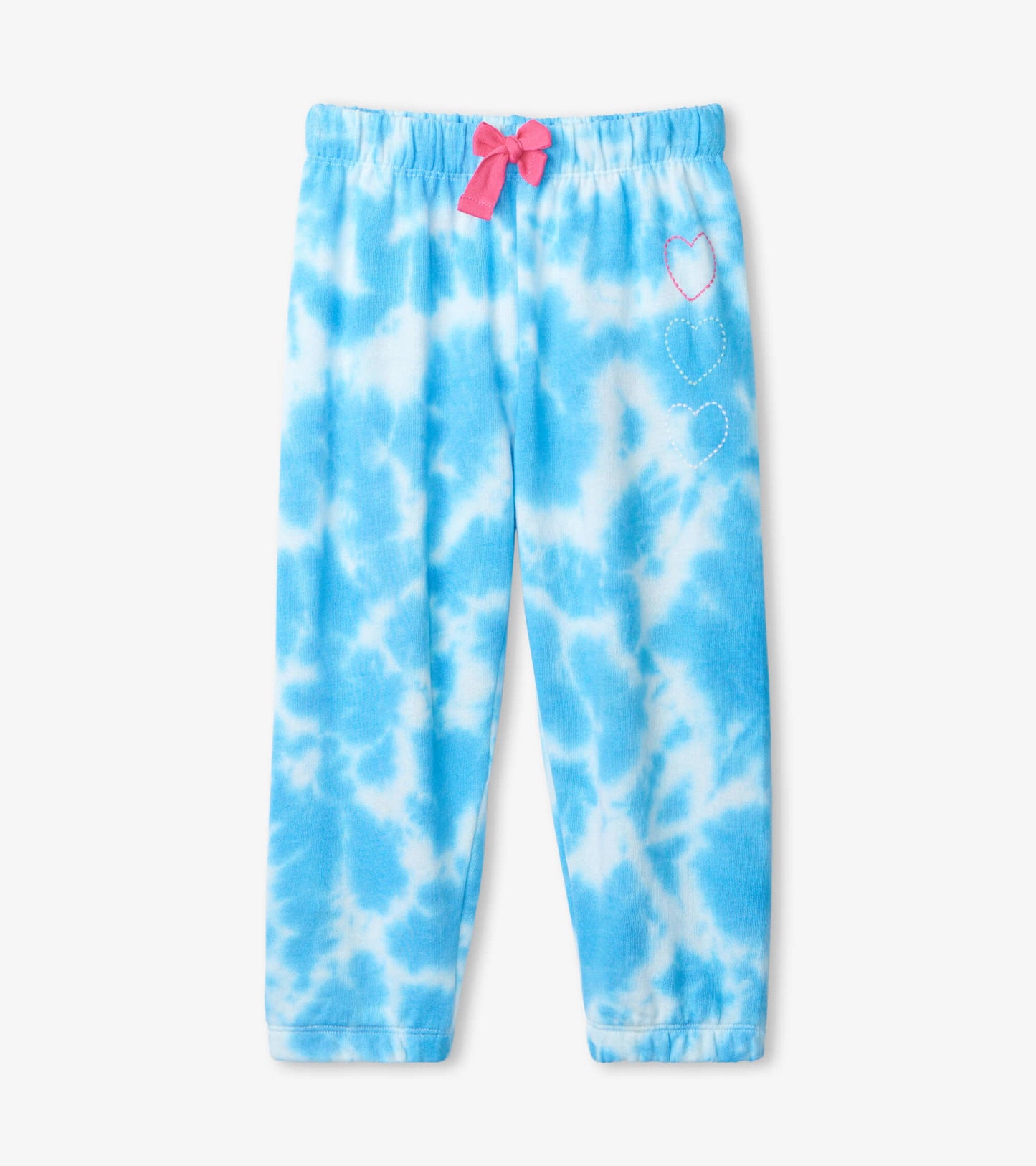 Blue tie-dye joggers with a pink bow at the waist and heart designs on the side, featuring a relaxed fit.