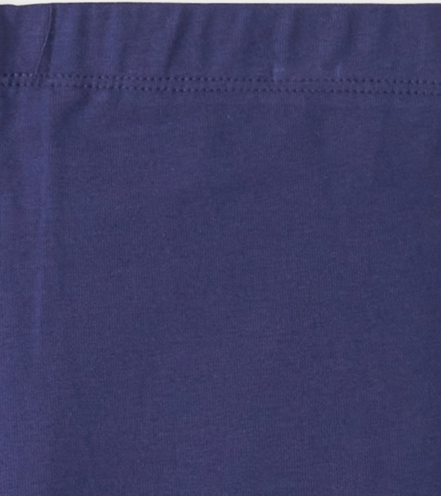 Navy bike shorts made from soft, stretchy fabric, featuring an elastic waistband for comfort.