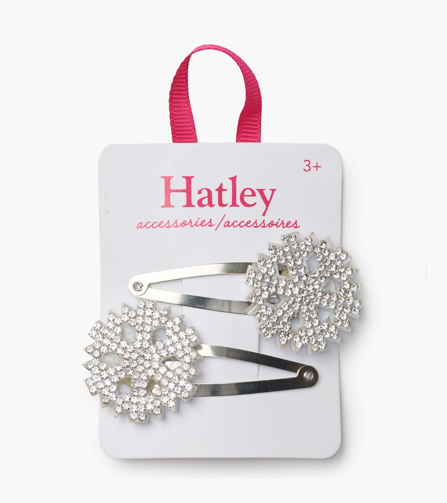 Silver snap clips featuring festive snowflake designs adorned with sparkling rhinestones.