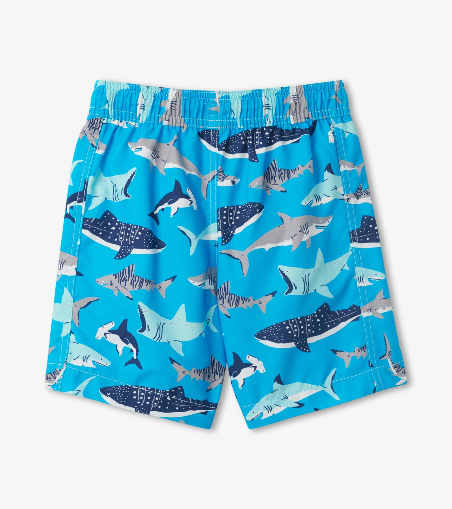 Blue swim trunks featuring a playful shark pattern in various shades, designed for kids.