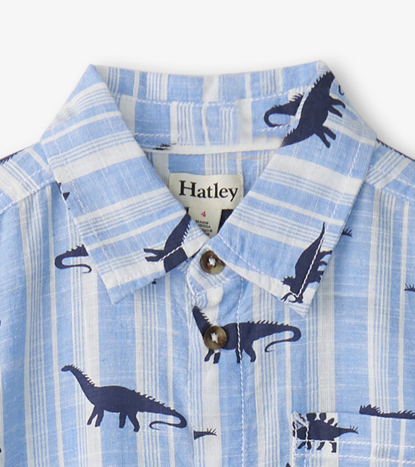 Light blue button-down shirt featuring navy dinosaur patterns and a classic collar.