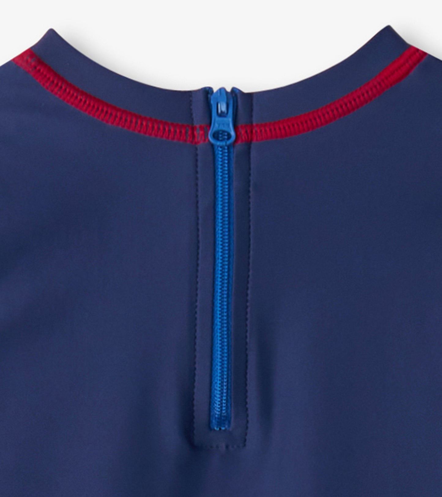 Navy one-piece rashguard with red trim and blue zipper at the back, designed for baby boys.