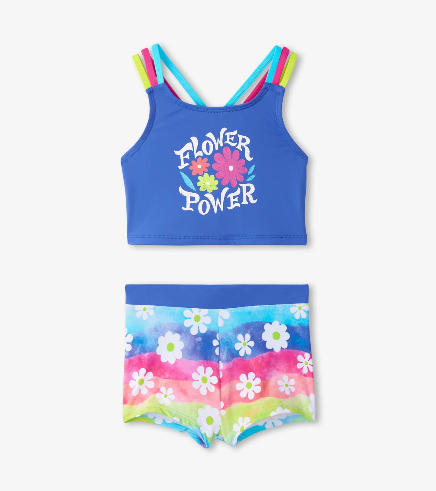 Blue crop top with colorful straps and "Flower Power" print, paired with rainbow-striped shorts featuring floral patterns.