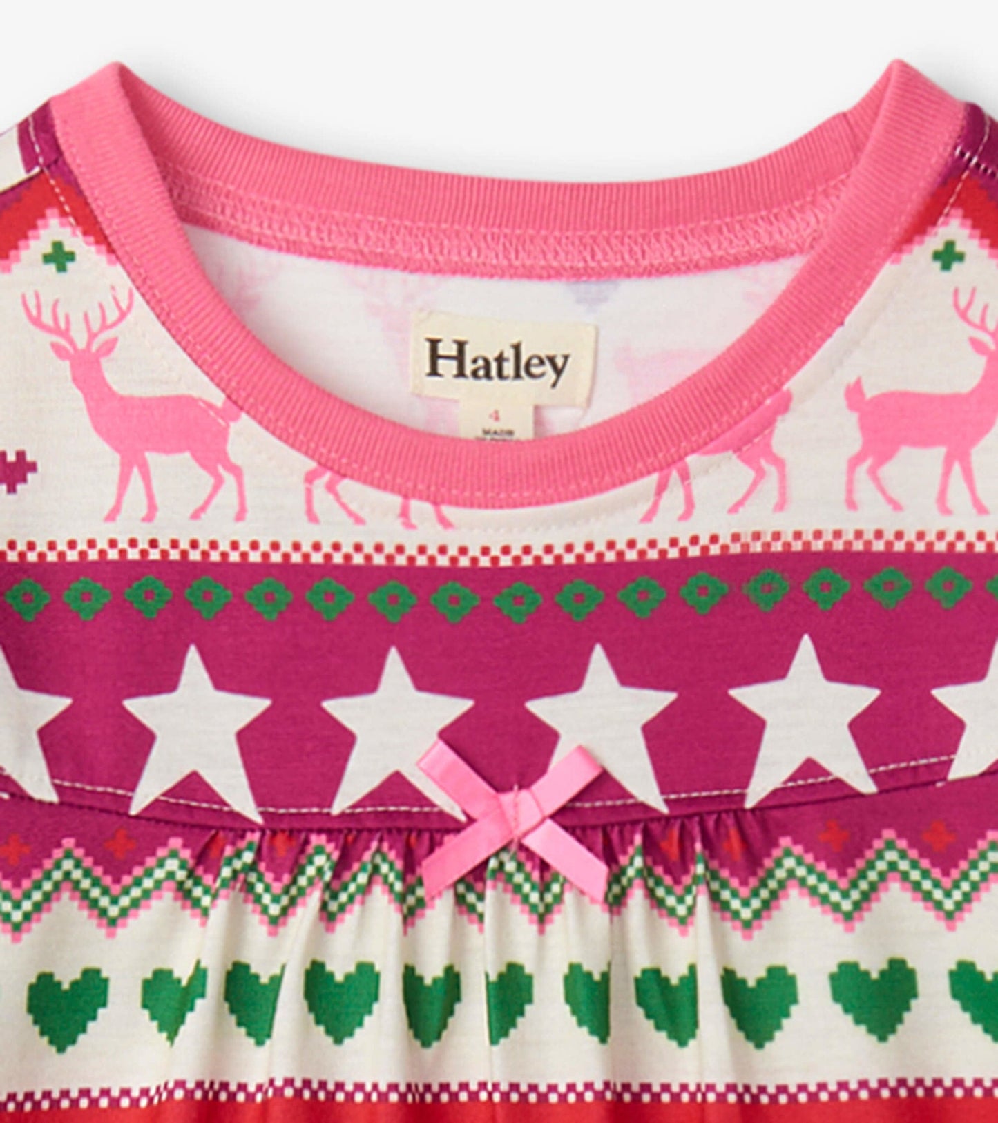 Long sleeve girls' nightgown featuring a pink Fair Isle pattern with reindeer, stars, and hearts. Soft cotton material.
