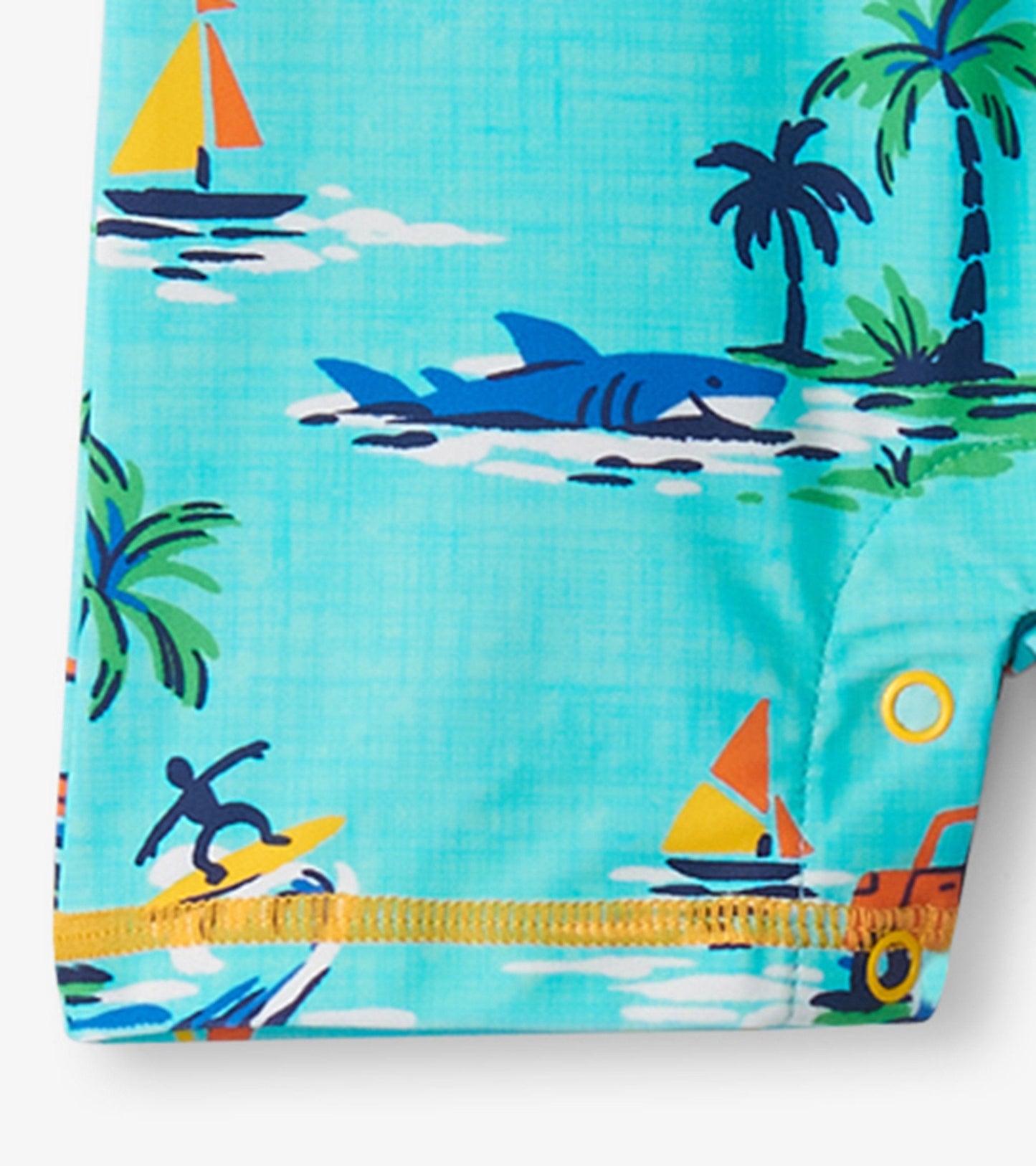 Turquoise one-piece rashguard featuring colorful beach-themed prints, including sharks, sailboats, and palm trees.