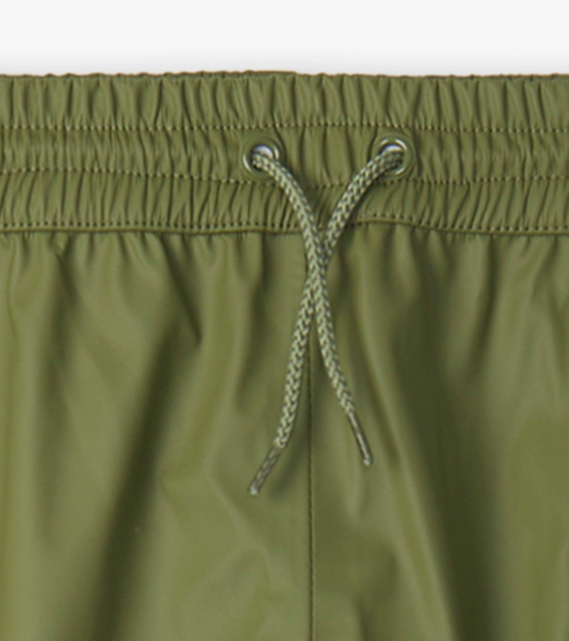 Forest green waterproof kids' rain pants with an elastic waistband and adjustable drawstring.