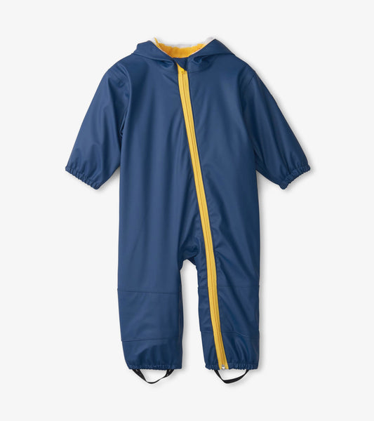 Navy waterproof baby rain suit with a yellow zipper and hood, featuring elastic cuffs and foot straps.