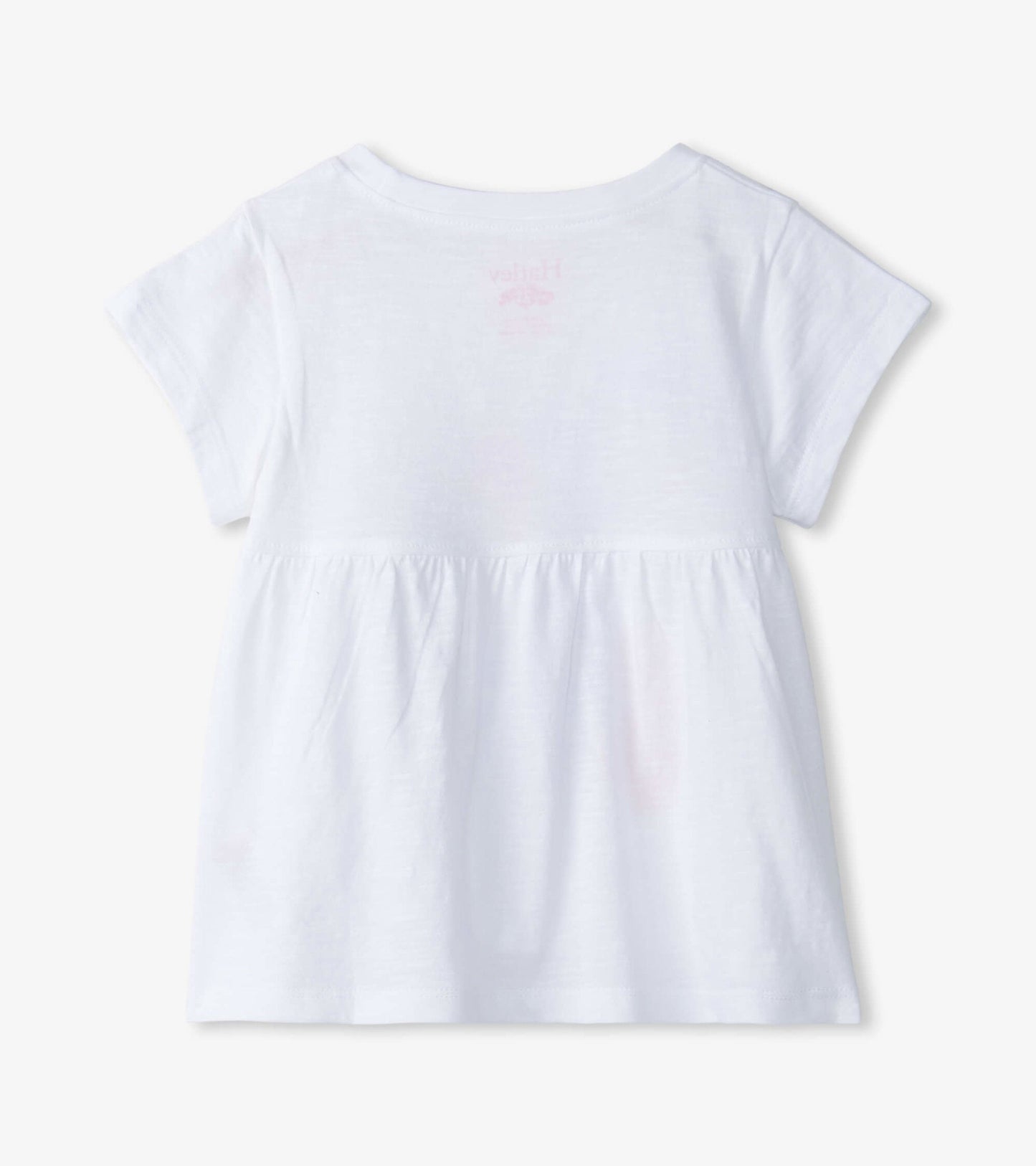 White short-sleeve graphic tee for baby and toddler girls with a gathered waist and soft fabric. Back view shown.