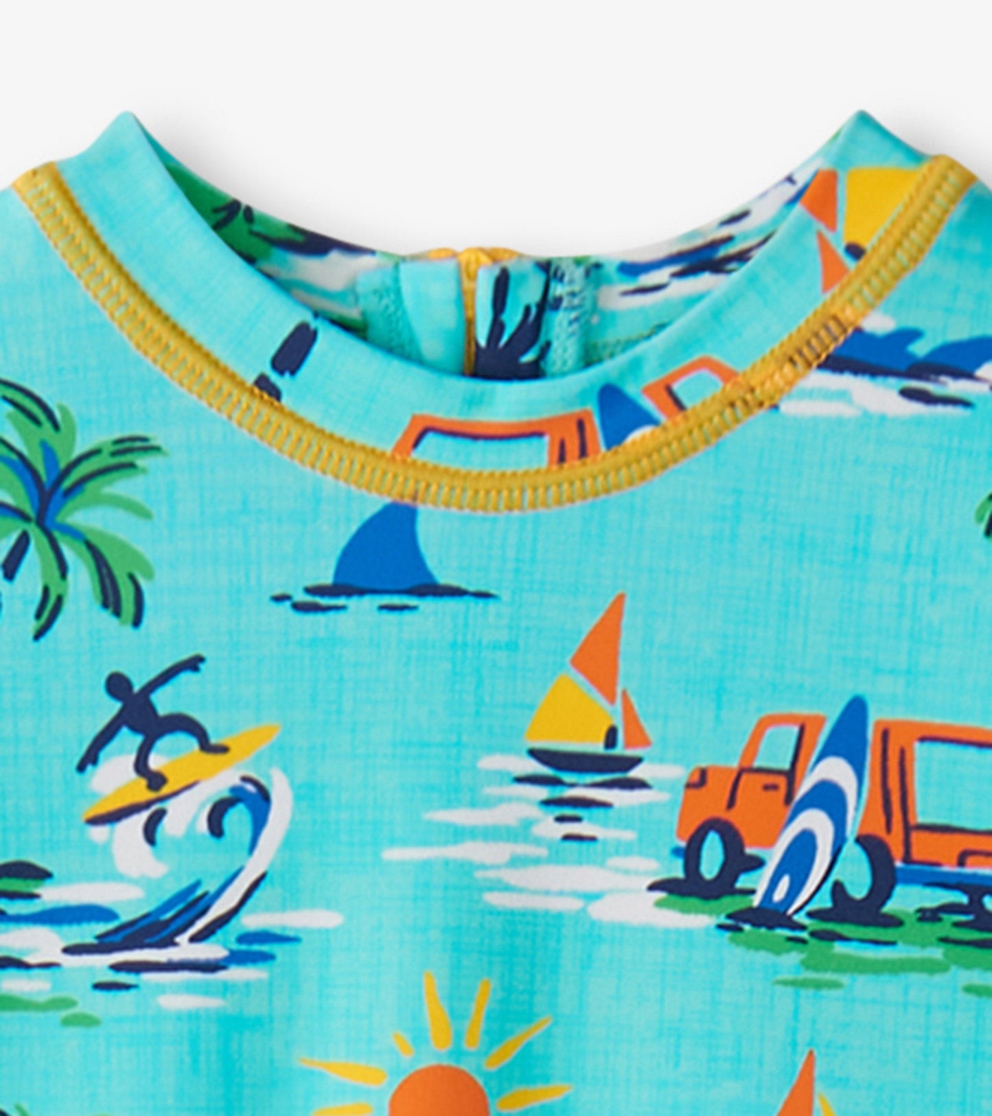 Light blue one-piece rashguard featuring colorful beach-themed graphics, including surfboards, palm trees, and sailboats.