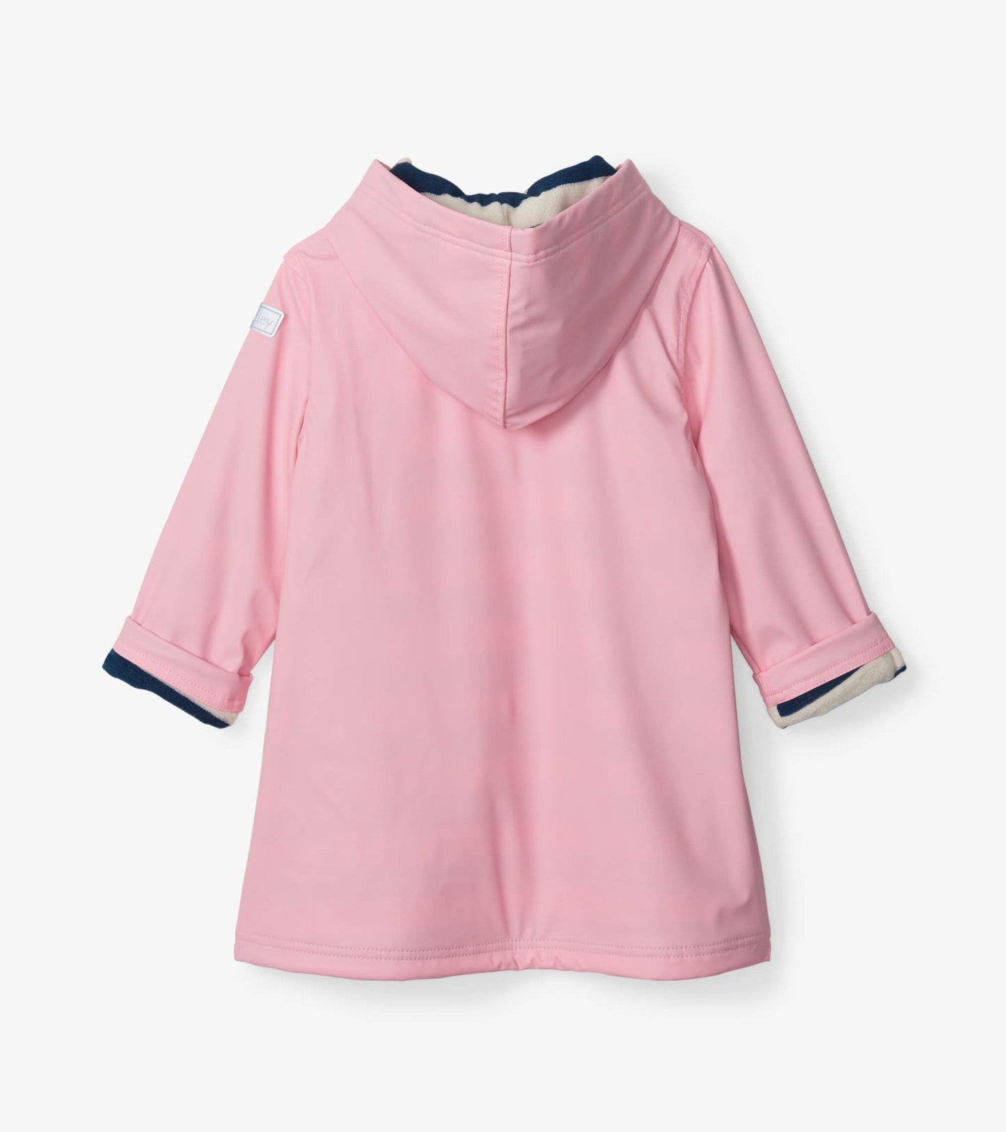 Pink raincoat with a navy hood and cuffs, featuring a button-up design and long sleeves.